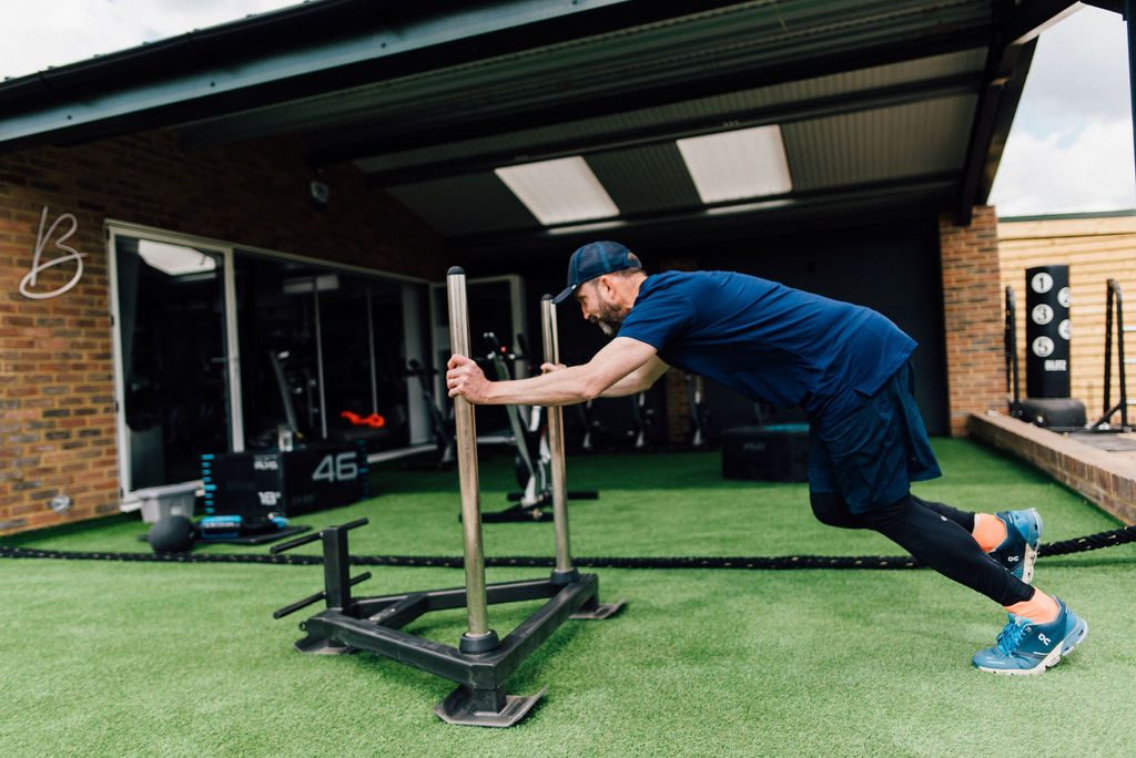 Sled push on the turf at Bodyworx